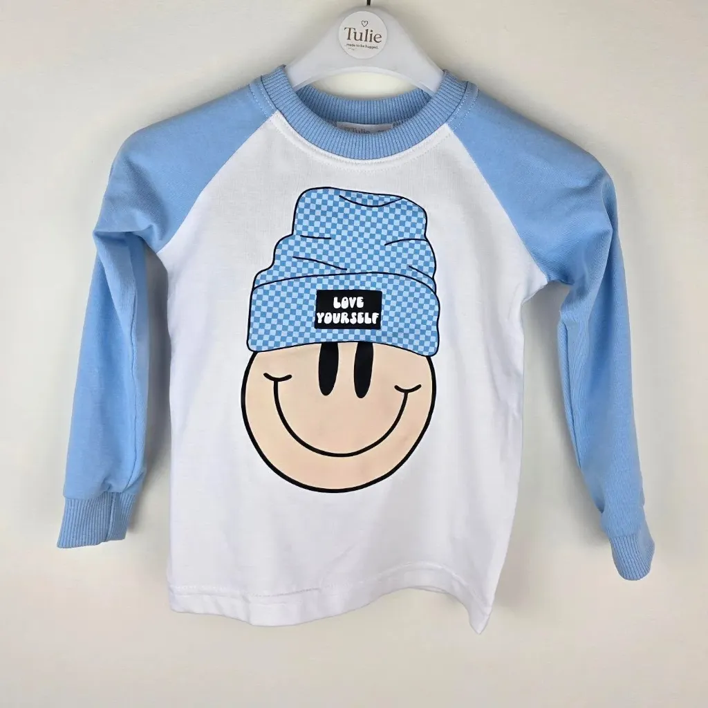 Biało-niebieski longsleeve dziecięcy ze smiley – Love Yourself